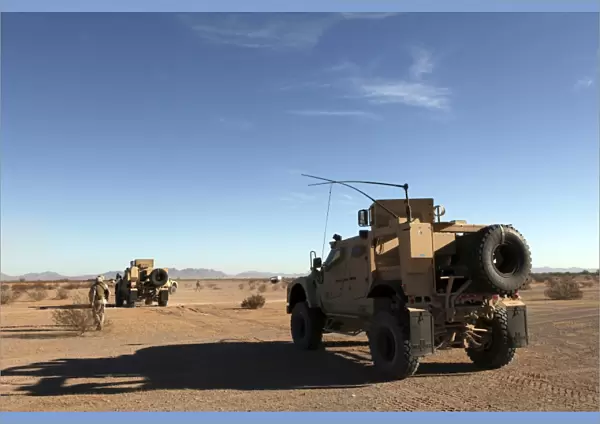 U. S. Marines guide M-ATVs through the Arizona desert