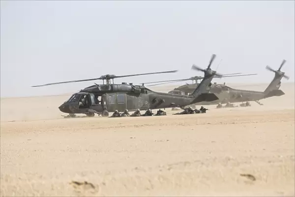 UH-60 Blackhawk helicopters air drop soldiers in Kuwait