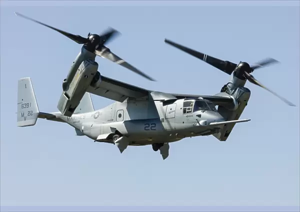 A U. S. Marine Corps V-22 Osprey transitions to wingborne flight