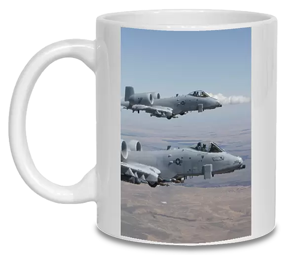 Two A-10 Thunderbolts fly over the Saylor Creek bombing range, Idaho