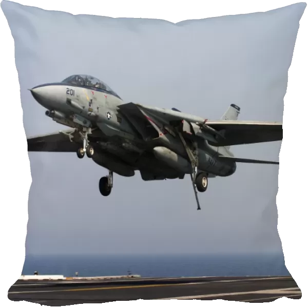 An F-14D Tomcat comes in for an arrested landing on the flight deck of USS Theodore