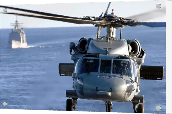 An MH-60S Seahawk helps conduct a vertical replenishment