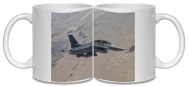 An F-16 maneuvers during a training mission over Arizona