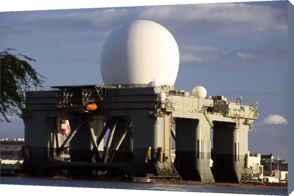 Sea Based X-band Radar dome modeled by the setting sun at Pearl Harbor naval shipyard
