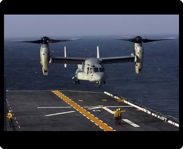 A V-22 Osprey aircraft prepares to land aboard the USS Bataan in the Atlantic Ocean