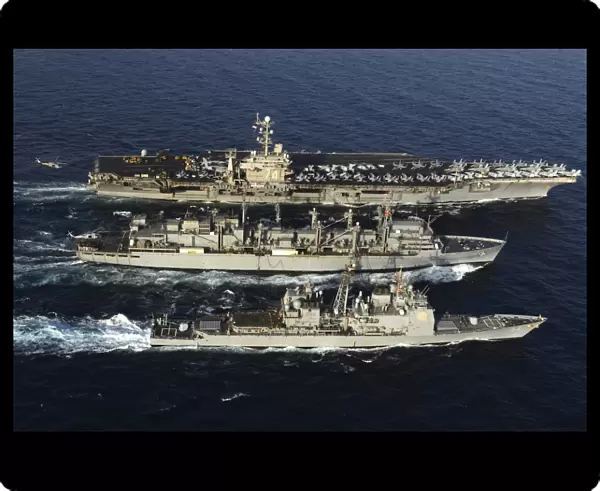 USNS Bridge conducts a replenishment at sea with USS John C. Stennis and USS Mobile Bay
