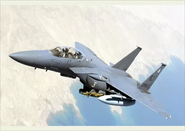 A U. S. Air Force F-15E Strike Eagle aircraft flies over Iraq