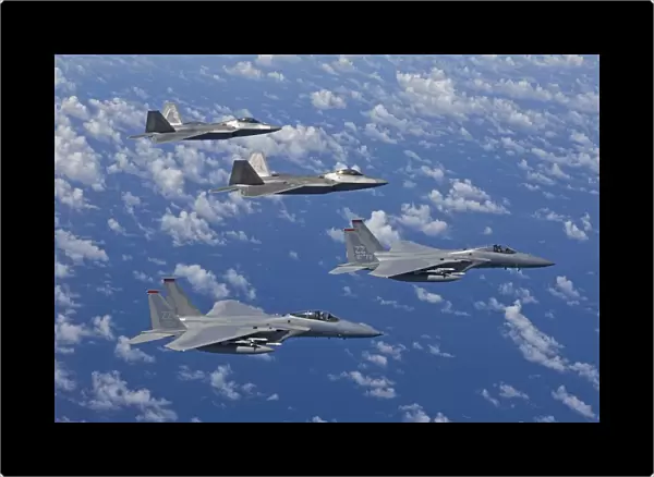 Two F-15 Eagles and F-22 Raptors fly in formation