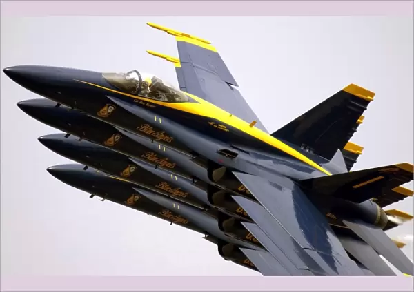 Four Blue Angels F  /  A-18C Hornets perform the Echelon Parade maneuver