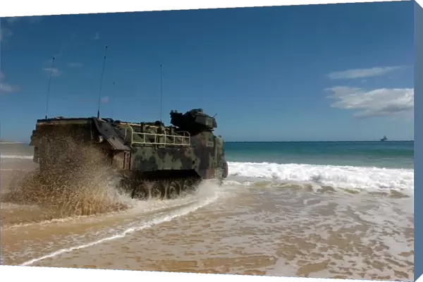 U. S. Marines drive an amphibious assault vehicle ashore