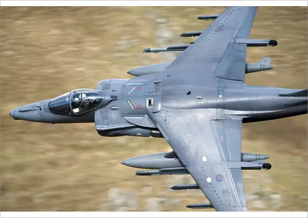 A Royal Air Force Harrier GR9 flying low over North Wales
