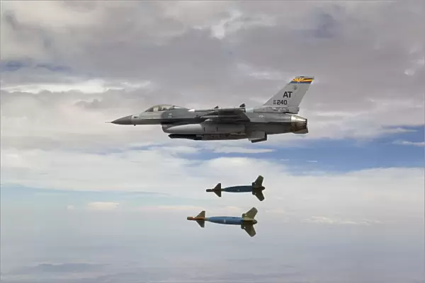 An F-16 Fighting Falcon releases two GBU-24 laser guided bombs