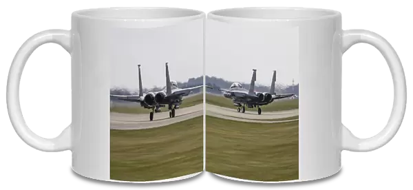 F-15E Strike Eagles of the U. S. Air Force line up for takeoff