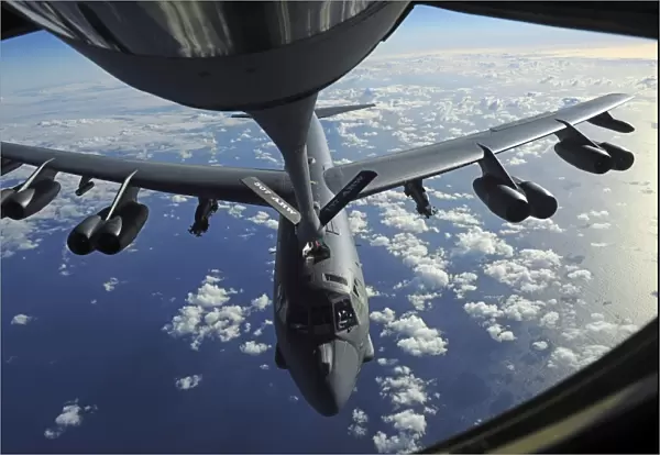 A KC-135 Stratotanker aircraft refuels a B-52 Stratofortress aircraft over the Pacific