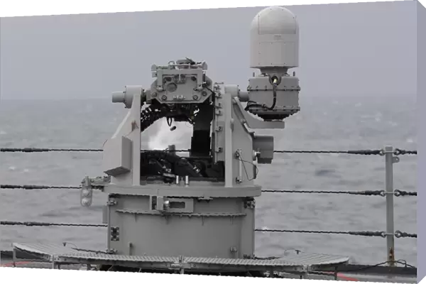 A 25mm machine gun is fired aboard USS Blue Ridge