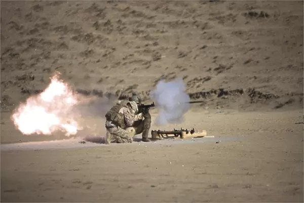 A soldier fires a rocket-propelled grenade launcher