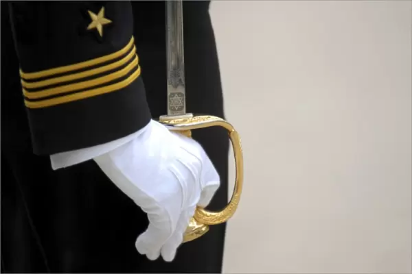 A U. S. Naval Academy midshipman stands at attention