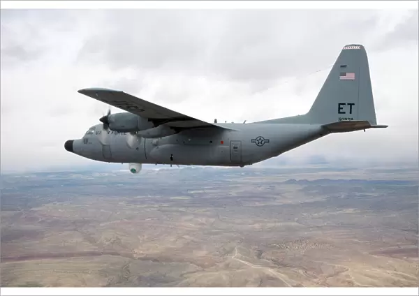 A C-130 Hercules soars through the sky