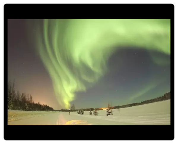 The Aurora Borealis, or Northern Lights, shines above Bear Lake