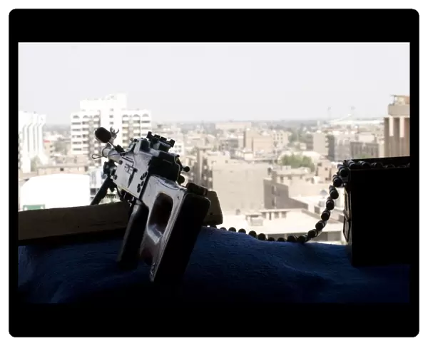 A PK 7. 62mm machine gun nest on top of the Baghdad Hotel during Operation Iraqi Freedom