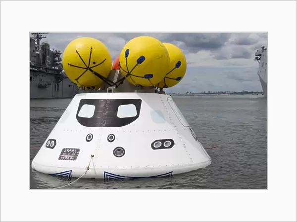 An Orion capsule before being towed into the well deck of USS Arlington