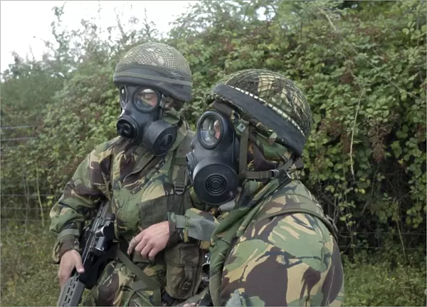 British soldiers in full NBC protection gear and a S6 respirator