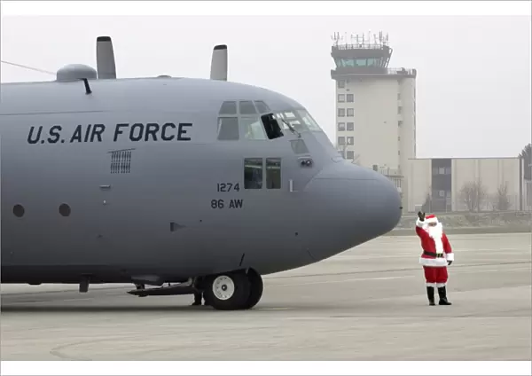 Santa arrives by a C-130 Hercules