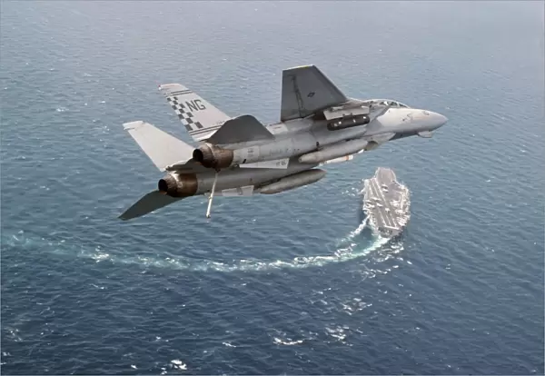 An F-14A Tomcat eturns to USS Nimitz after Operation Southern Watch