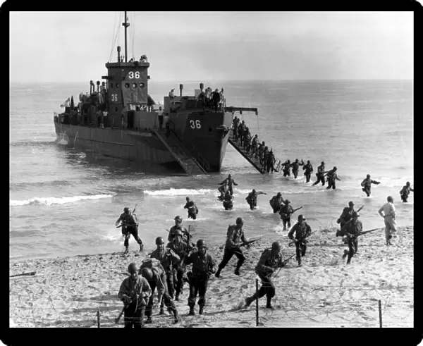 Soldiers of the U. S. Army invade the beach during Operation Torch in North Africa
