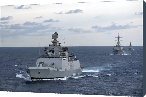 The Indian Navy frigate INS Satpura is underway with U. S. Navy ships