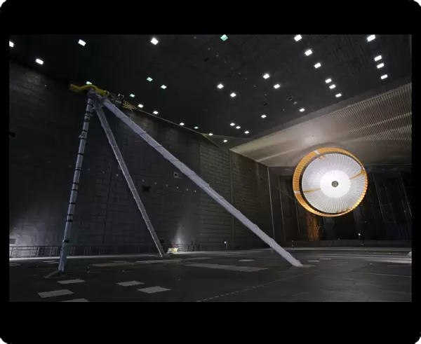 A parachute undergoes flight-qualification testing inside a wind tunnel