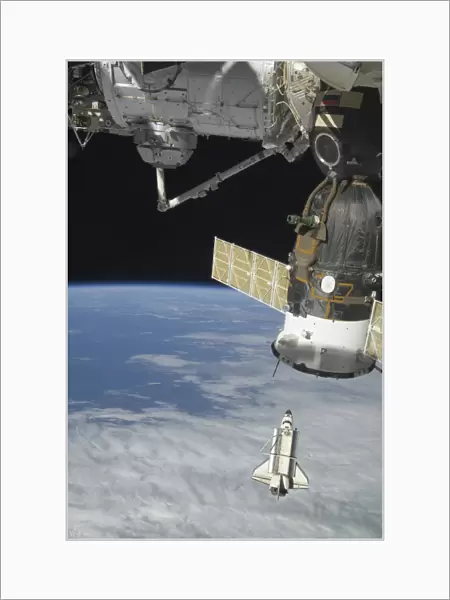 Space shuttle Endeavour, a Soyuz spacecraft, and the International Space Station