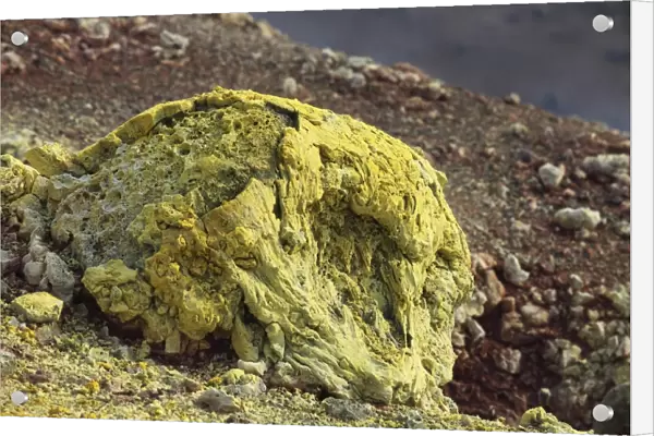 Lava bomb coated in yellow sulphurous fumarole deposits