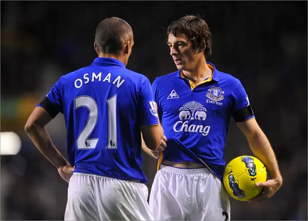Deep in Conversation: Leighton Baines and Leon Osman at Goodison Park during Everton vs Stoke City, Barclays Premier League (2011)