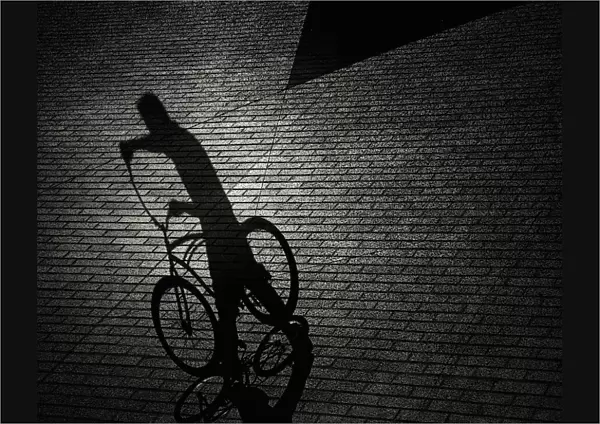 Man and bicycle shadows