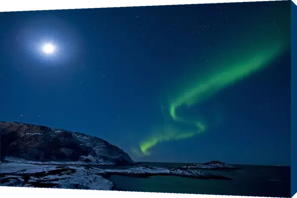 Northern lights in moonlit sky, northern Finland, March 2009