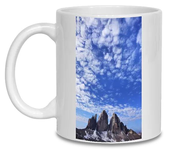Tre Cime di Lavaredo mountains with clouds in the sky, Sexten Dolomites, South Tyrol