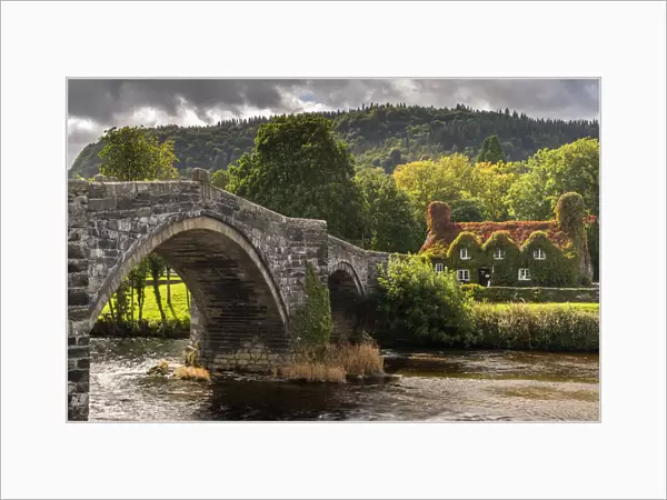 Bridge and ivy covered cottage, LLanwrst, Conwy Valley, at the edge of the Snowdonia National Park