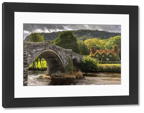 Bridge and ivy covered cottage, LLanwrst, Conwy Valley, at the edge of the Snowdonia National Park