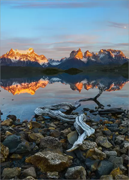 Towers and Central Massif reflected in Lago Pehoe at sunrise. Torres del Paine National Park