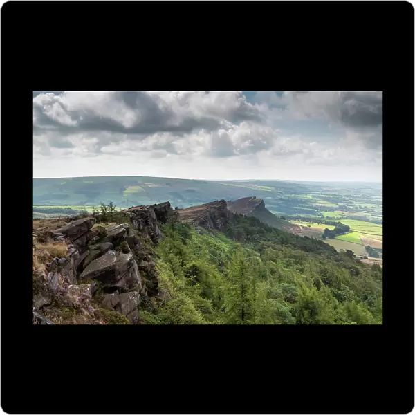 View along the Roaches Ridge towards the distinctive hill, Hen Cloud. The ridge is an escarpment of dipping Carboniferous, Namurian Sandstone, near Leek, Staffordshire, UK. August, 2022