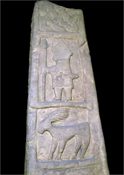 Cross-shaft fragment showing a warrior with sword, spear, 10th century
