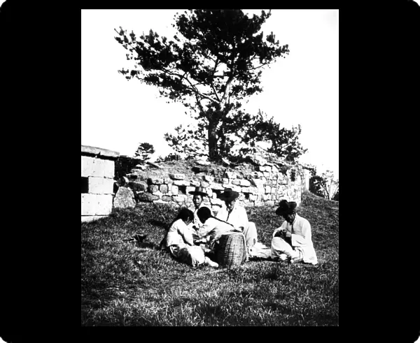 Family enjoying a picnic, Korea, 1900