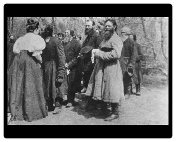 Landowner giving the Paschal greeting to her peasants, Russia, 1890s