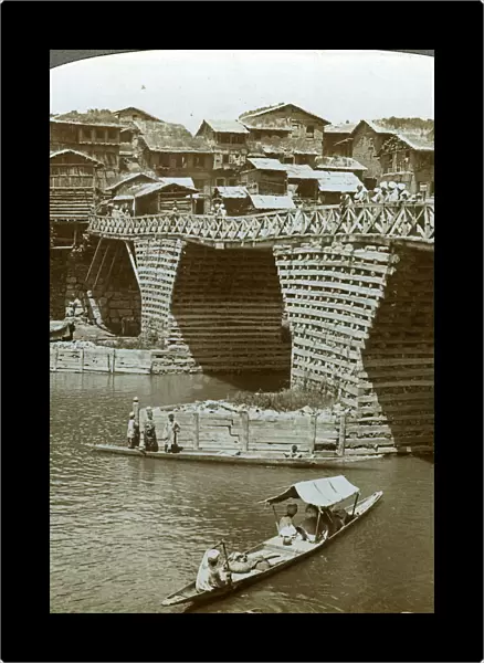 Quaint bridge and houses, City of Sun, Kashmir, India, c1900s(?). Artist: Underwood & Underwood