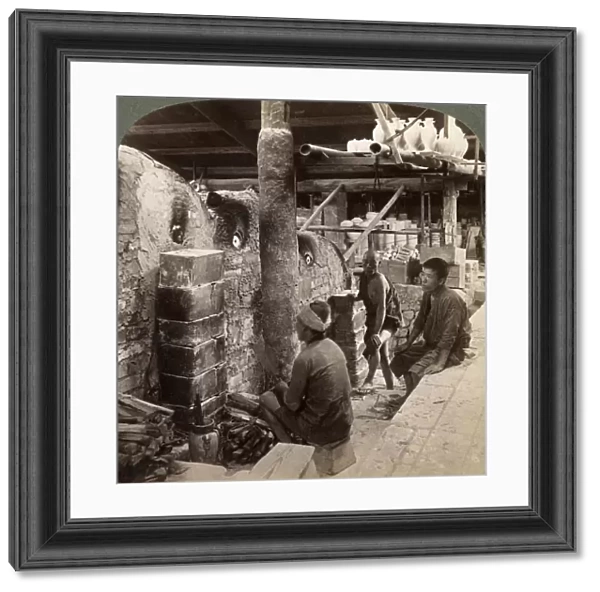 Workmen watching kilns full of Awata porcelain, Kinkosan works, Kyoto, Japan, 1904. Artist: Underwood & Underwood