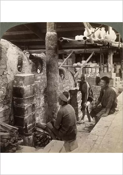 Workmen watching kilns full of Awata porcelain, Kinkosan works, Kyoto, Japan, 1904. Artist: Underwood & Underwood