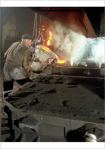 Pouring molten metal from a cupola into moulds, steel bath production, Hull, Humberside, 1965