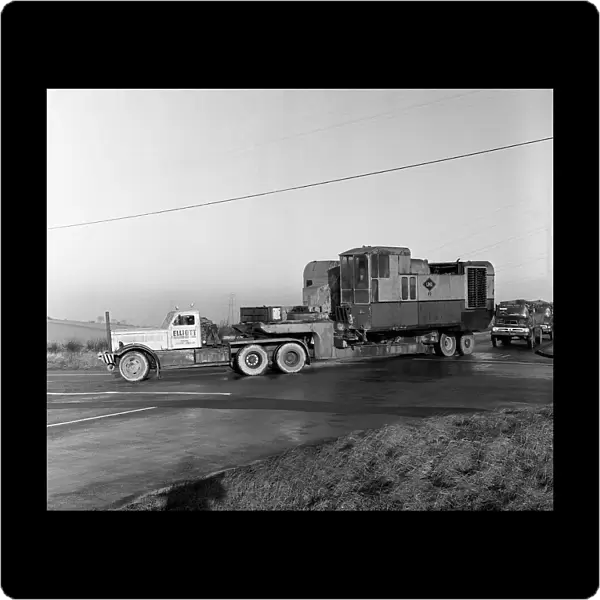 Early 1940s Diamond T truck pulling a large load, South Yorkshire, 1962