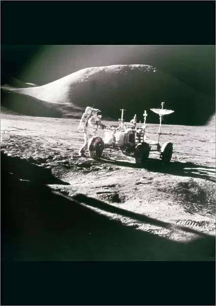 Astronaut with Lunar Roving Vehicle on the Moon, 1970s. Creator: NASA